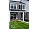 Two-story home features black shutters, a well-maintained lawn, and a front walkway at 19450 Northwest Dr, Westfield, IN 46074