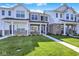 Charming townhomes showcasing well-manicured lawns and inviting front entrances at 19450 Northwest Dr, Westfield, IN 46074