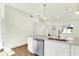 Open kitchen offers stainless steel appliances, quartz countertops and seamless flow at 19450 Northwest Dr, Westfield, IN 46074