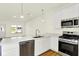 Bright kitchen featuring stainless steel appliances, quartz countertops and wooden floors at 19450 Northwest Dr, Westfield, IN 46074