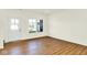 Bright room with hardwood floors, a view to the front of the home, and white walls at 19450 Northwest Dr, Westfield, IN 46074