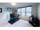 Bright basement features large windows and exercise equipment with neutral carpeting at 1972 Rhettsbury St, Carmel, IN 46032