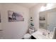 Charming half bath featuring neutral wall color and modern decor, with attractive barn art at 1972 Rhettsbury St, Carmel, IN 46032