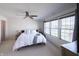 Bright bedroom featuring a ceiling fan and large windows for natural light at 1972 Rhettsbury St, Carmel, IN 46032