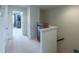 Bright hallway leading to rooms, featuring fresh carpet and neutral paint at 1972 Rhettsbury St, Carmel, IN 46032