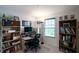 Functional home office with ample shelving, a built-in desk, and natural light from the window at 1972 Rhettsbury St, Carmel, IN 46032