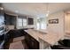 Bright kitchen featuring granite countertops, dark cabinetry, pendant lighting, and stainless steel appliances at 1972 Rhettsbury St, Carmel, IN 46032