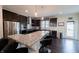 Well-equipped kitchen with granite countertops, island seating, and stainless steel appliances at 1972 Rhettsbury St, Carmel, IN 46032