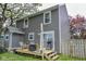Charming backyard deck with grill, wicker seating, and tasteful decorations under soft string lights at 2235 N Kenwood Ave, Indianapolis, IN 46208