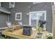 Inviting backyard deck featuring cozy wicker chairs, a grill, and an outdoor table for relaxed entertaining at 2235 N Kenwood Ave, Indianapolis, IN 46208