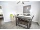 Cozy dining room with hardwood floors, a farmhouse-style table, and stylish decor at 2235 N Kenwood Ave, Indianapolis, IN 46208