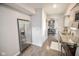Well-lit kitchen featuring stainless steel appliances, modern cabinetry, and hardwood floors at 2235 N Kenwood Ave, Indianapolis, IN 46208