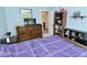Inviting bedroom with a dresser, bookshelf, and comfortable bed at 2330 Oak Dr, Clayton, IN 46118