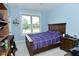 Comfortable bedroom featuring a wooden bed frame, bedside tables, and natural light at 2330 Oak Dr, Clayton, IN 46118