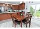 Cozy dining area with wood table and chairs, adjacent to kitchen with natural light at 2330 Oak Dr, Clayton, IN 46118