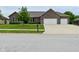Beautiful brick home featuring a two-car garage and well-maintained landscaping at 2330 Oak Dr, Clayton, IN 46118