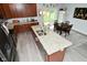 Modern kitchen with a large island, stainless steel appliances, and adjacent dining area at 2330 Oak Dr, Clayton, IN 46118