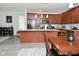 Spacious kitchen with island and dark wood cabinets, open to dining area at 2330 Oak Dr, Clayton, IN 46118