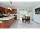 Modern kitchen and dining area with a large island, stainless appliances and light-filled dining at 2330 Oak Dr, Clayton, IN 46118