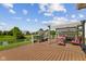 Backyard deck with built-in seating, a grill, and a pond with a serene view at 2447 Stonehaven Dr, Avon, IN 46123