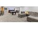Open basement with a pool table, seating area, and bar; ideal for entertaining guests at 2447 Stonehaven Dr, Avon, IN 46123