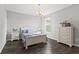 A cozy bedroom with a dark hardwood floor and lots of natural light at 2447 Stonehaven Dr, Avon, IN 46123