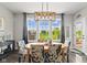 Bright dining room with hardwood floors and big windows overlooking the lawn at 2447 Stonehaven Dr, Avon, IN 46123