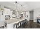 A kitchen with a large island, quartz countertops, stainless steel appliances and hardwood floors at 2447 Stonehaven Dr, Avon, IN 46123