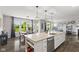 A bright kitchen with a large island flowing into the dining and living room area at 2447 Stonehaven Dr, Avon, IN 46123