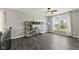Versatile living room with large window, modern flooring, and well-lit; perfect flex space at 2447 Stonehaven Dr, Avon, IN 46123