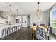 Open concept kitchen and dining room area with hardwood floors at 2447 Stonehaven Dr, Avon, IN 46123