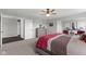 Comfortable main bedroom featuring gray walls, carpet flooring, and a modern ceiling fan at 2447 Stonehaven Dr, Avon, IN 46123