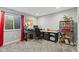Bright office space with desk, shelving, and window; a perfect work-from-home setup at 2447 Stonehaven Dr, Avon, IN 46123