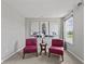 Cozy sitting area with patterned chairs, modern art, and natural light from the window at 2447 Stonehaven Dr, Avon, IN 46123