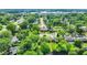 Aerial view of a charming home nestled among lush trees in a serene neighborhood at 2538 Sickle Rd, Indianapolis, IN 46219