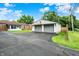 A two-car garage with a paved driveway and a well-maintained lawn, complementing the surrounding residential neighborhood at 2538 Sickle Rd, Indianapolis, IN 46219