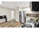 Well-lit kitchen features stainless steel appliances, sleek floors, and modern white cabinetry at 2538 Sickle Rd, Indianapolis, IN 46219