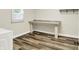 Laundry room featuring countertop, storage, and laminate floors at 2538 Sickle Rd, Indianapolis, IN 46219