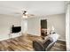Bright living room with hardwood floors, ceiling fan, and neutral paint at 2538 Sickle Rd, Indianapolis, IN 46219