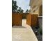 Newly fenced backyard featuring a well-maintained cement walkway at 2936 Guilford Ave, Indianapolis, IN 46205