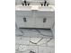 Bathroom featuring a double sink vanity with marble floors and black fixtures at 2936 Guilford Ave, Indianapolis, IN 46205