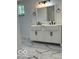 Bathroom featuring double sink vanity with marble floors and black fixtures at 2936 Guilford Ave, Indianapolis, IN 46205
