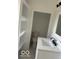 Bright bathroom with white cabinets, shelving, and tile flooring, complete with modern fixtures at 2936 Guilford Ave, Indianapolis, IN 46205