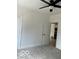 Bedroom with neutral carpet, ceiling fan, and white trim at 2936 Guilford Ave, Indianapolis, IN 46205