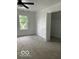 A sunny bedroom with a ceiling fan and open closet at 2936 Guilford Ave, Indianapolis, IN 46205