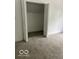 A walk-in closet with an open door reveals a spacious storage area at 2936 Guilford Ave, Indianapolis, IN 46205