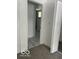 Open closet door revealing bathroom with marbled floors and black fixtures at 2936 Guilford Ave, Indianapolis, IN 46205