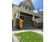 Inviting two-story home showcasing a covered porch and freshly painted exterior at 2936 Guilford Ave, Indianapolis, IN 46205