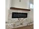 Close-up of the modern electric fireplace featuring a marble surround at 2936 Guilford Ave, Indianapolis, IN 46205