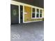 Charming covered front porch with freshly painted address and exterior lighting at 2936 Guilford Ave, Indianapolis, IN 46205